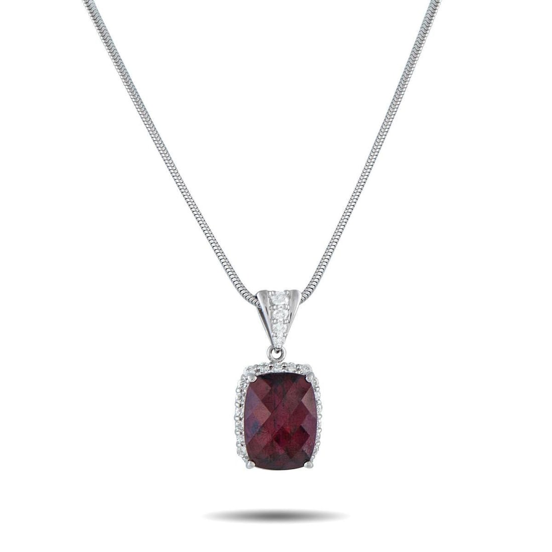 PLATINUM 0.80CT DIAMOND AND RHODOLITE GARNET PENDANT NECKLACE: On this exquisite necklace, a 14.40 carat Rhodolite Garnet gemstone provides a stylish pop of color. Set in Platinum, the pendant measures 1.13 long by 0.50 wide and is suspended from a 19 chain.