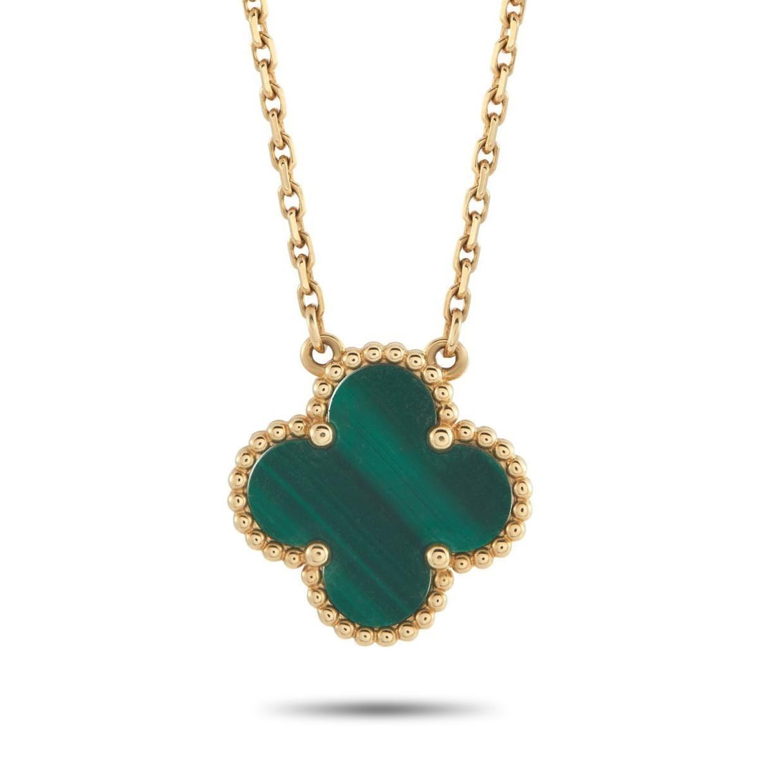 VAN CLEEF & ARPELS ALHAMBRA 18K YELLOW GOLD MALACHITE PENDANT NECKLACE: The luxury brands iconic clover motif takes center stage on this exquisite Van Cleef & Arpels Alhambra necklace. Crafted from 18K Yellow Gold, the pendant includes intricate beadwork around the perime