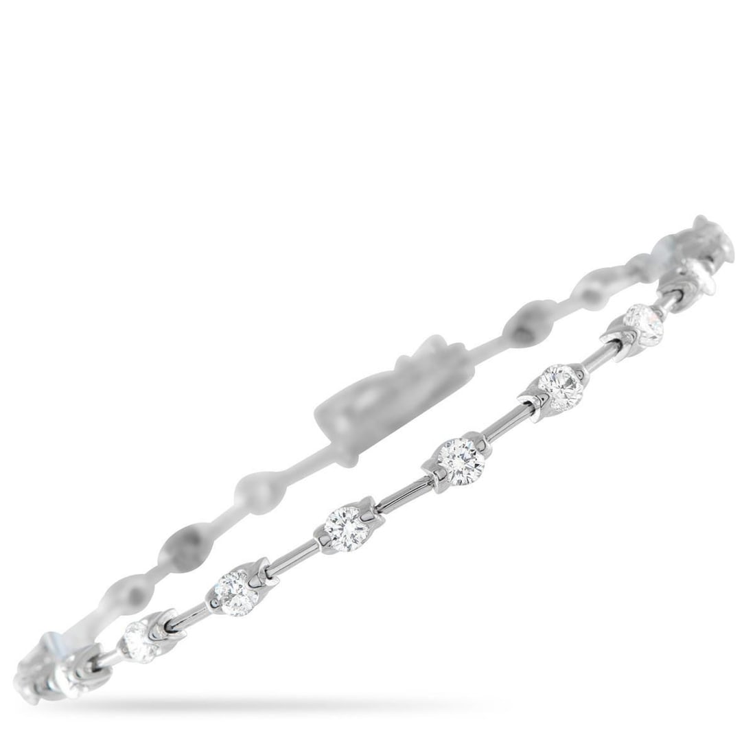 DE BEERS 18K WHITE GOLD 2.50CT DIAMOND BRACELET: This De Beers bracelet is an understated accessory that will elevate any ensemble. The 18K White Gold setting beautifully showcases this pieces dazzling array of Diamonds totaling 2.50 carats. Simple