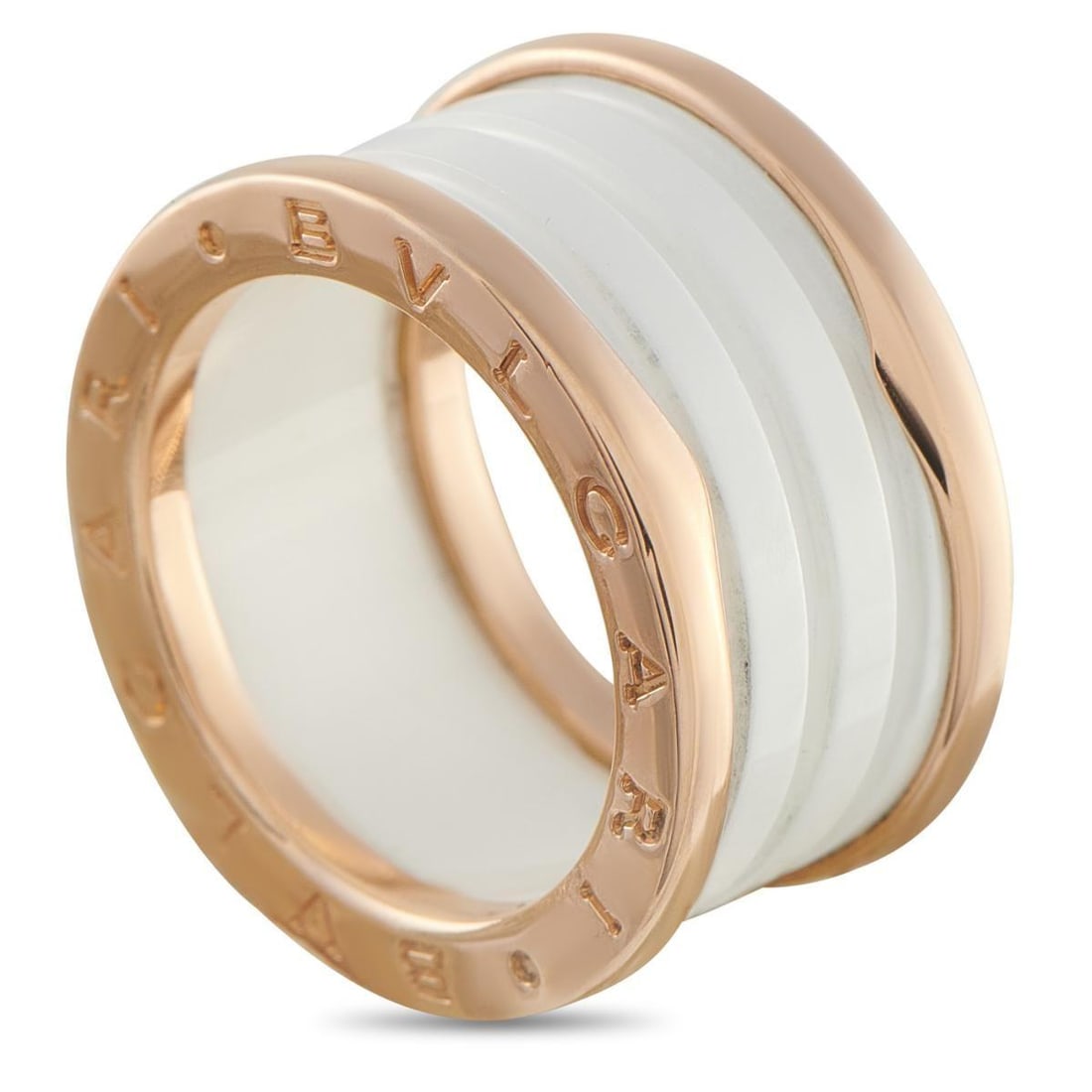 BVLGARI B.ZERO1 18K ROSE GOLD WHITE CERAMIC RING: This Bvlgari B.Zero1 ring is bold and endlessly impressive. At the center, a white ceramic accent highlights the collections signature swirl detail. The luxury brands name engraved at each end offers