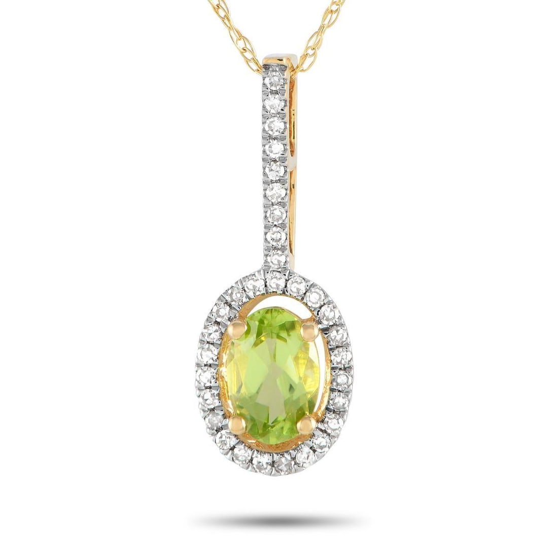 14K YELLOW GOLD 0.09CT DIAMOND AND PERIDOT PENDANT NECKLACE: A stunning oval-cut Peridot gemstone and sparkling Diamond accents totaling 0.09 carats come together beautifully on this necklaces simple, elegant pendant. Suspended from an 18 chain, the pendant mea
