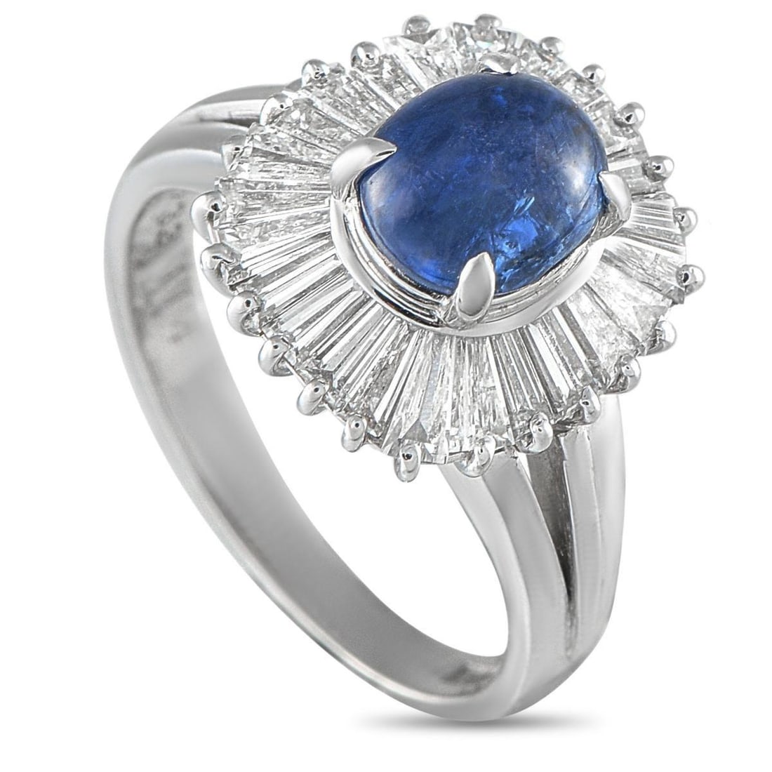 PLATINUM 1.14CT DIAMOND AND SAPPHIRE BALLERINA RING: Sculptural and romantic, this platinum ring centers on a smooth sapphire cabochon gracefully elevated to a 12mm top height. It is surrounded by a halo of tapered baguette diamonds in a ballerina setti
