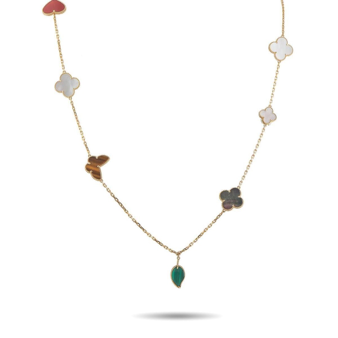 VAN CLEEF & ARPELS LUCKY ALHAMBRA 18K YELLOW GOLD NECKLACE: A joyful array of symbols crafted from various precious materials make this Van Cleef & Arpels Lucky Alhambra necklace simply unforgettable. Charming and instantly recognizable, it features the brands