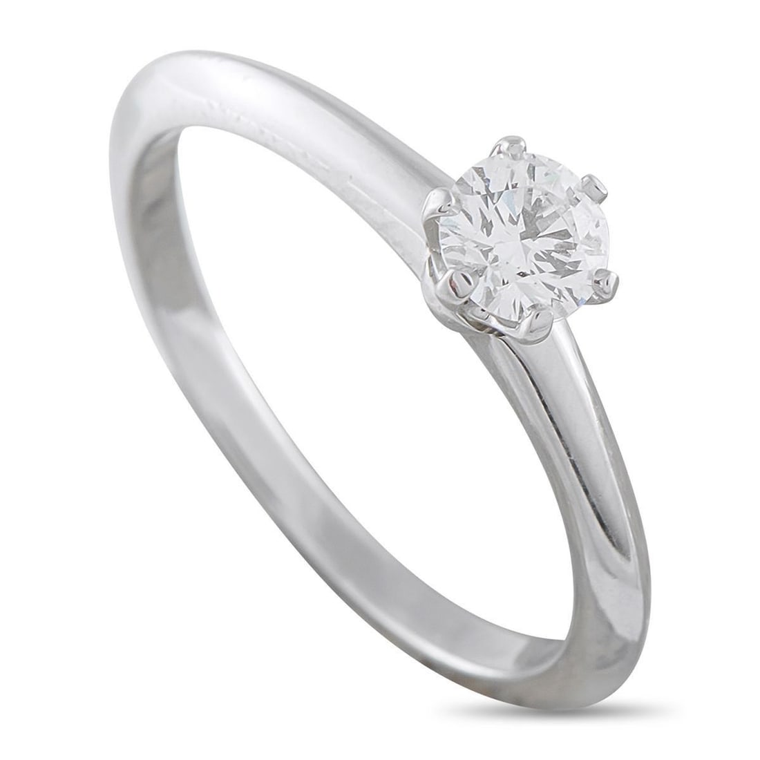 TIFFANY & CO. PLATINUM 0.29CT DIAMOND SOLITAIRE ENGAGEMENT RING: A 0.29 carat Round Brilliant Diamond with F color and VS2 clarity makes a statement at the center of this Tiffany & Co. solitaire engagement ring. Ideal for anyone with a minimalist aesthetic, the Pla