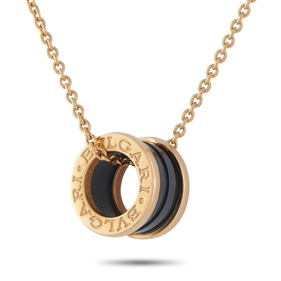 BVLGARI B.ZERO1 18K ROSE GOLD BLACK CERAMIC NECKLACE: Like all pieces from this iconic collection, this Bvlgari B.Zero1 necklace blends industrial design with the aesthetics of Roman architecture. The simple, circular pendant comes to life thanks to the