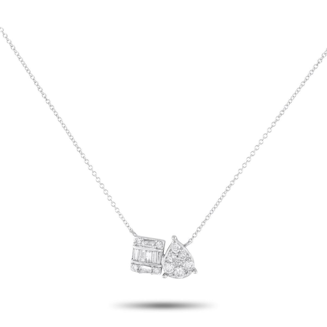 14K WHITE GOLD 0.50CT DIAMOND NECKLACE: A classic design ensures that this necklace will never go out of style. This pieces stunning 14K White Gold pendant measures 0.25 long by 0.48 wide and includes eye-catching geometric designs.