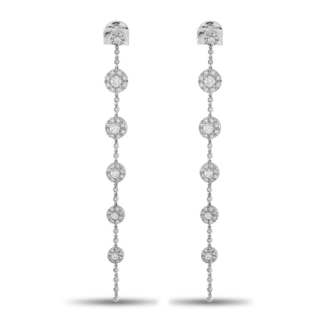 RABAT 18K WHITE GOLD 2.40CT DIAMOND LINE DROP EARRINGS: Crafted in white gold, these linear drop earrings by Rabat are defined by clean lines and subtle movement. Circular motifs are arranged in a vertical sequence, each set with a round diamond center