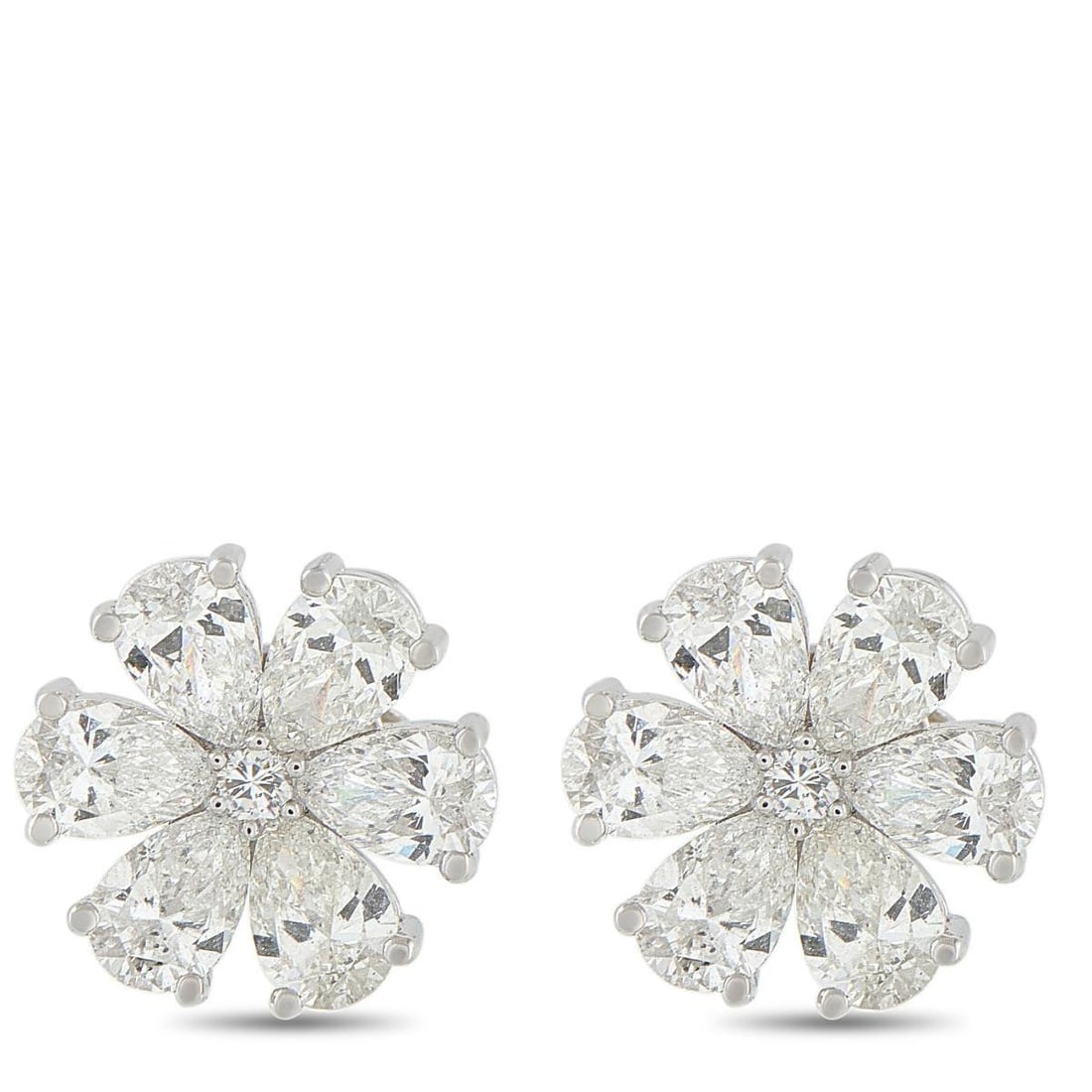 18K WHITE GOLD 2.70CT DIAMOND FLOWER EARRINGS: These stud earrings turn a classic floral motif into something more architectural and captivating. A petite round diamond lies at the center of each stud, surrounded by six pear-cut diamonds. Each pea