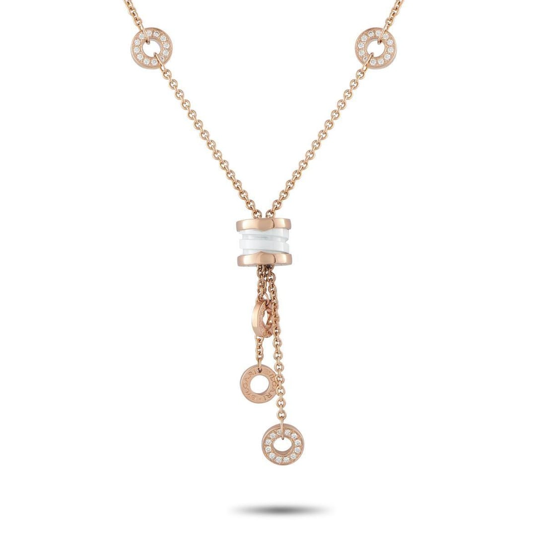BVLGARI B.ZERO1 18K YELLOW GOLD DIAMOND AND WHITE CERAMIC TASSEL LAVALIER NECKLACE: This Bvlgari B.Zero1 Tassel Lavalier is a uniquely elegant piece from one of the luxury brands most iconic collections. At the center, the brands spiral motif accented by white ceramic serves as a stu