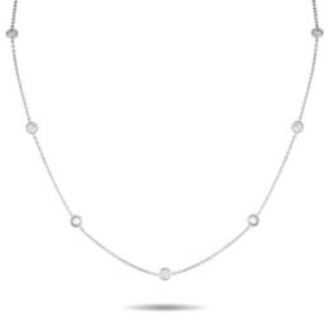 18K WHITE GOLD 1.75CT DIAMOND STATION NECKLACE: Versatile and always in style, this diamond station necklace is made to move with you. It fits in wherever the day takes you, from office hours to after-hours, with its tasteful design with a hint of