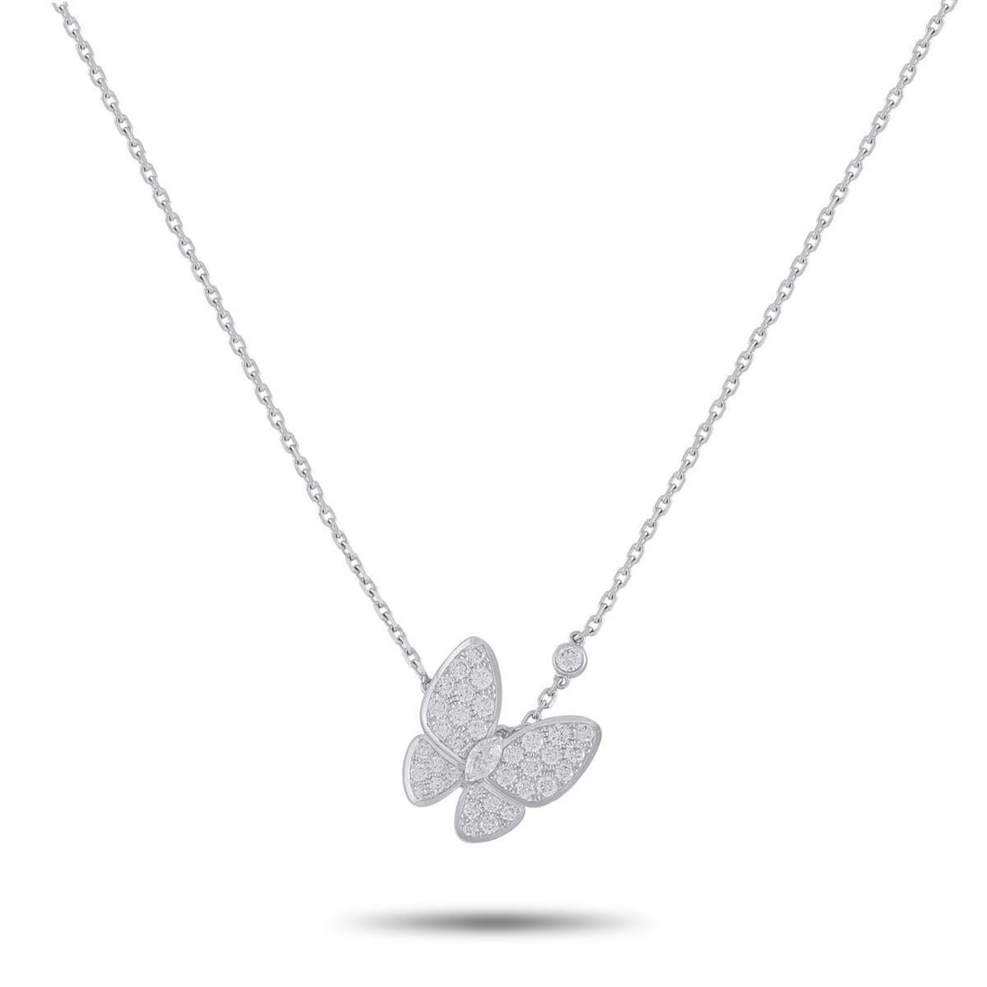 VAN CLEEF & ARPELS TWO BUTTERFLY 18K WHITE GOLD 0.88CT DIAMOND NECKLACE: An elegant, airy design makes this Van Cleef & Arpels Two Butterfly necklace instantly captivating. Covered in Diamonds totaling 0.88 carats, this exquisite accessory features an asymmetrical design t