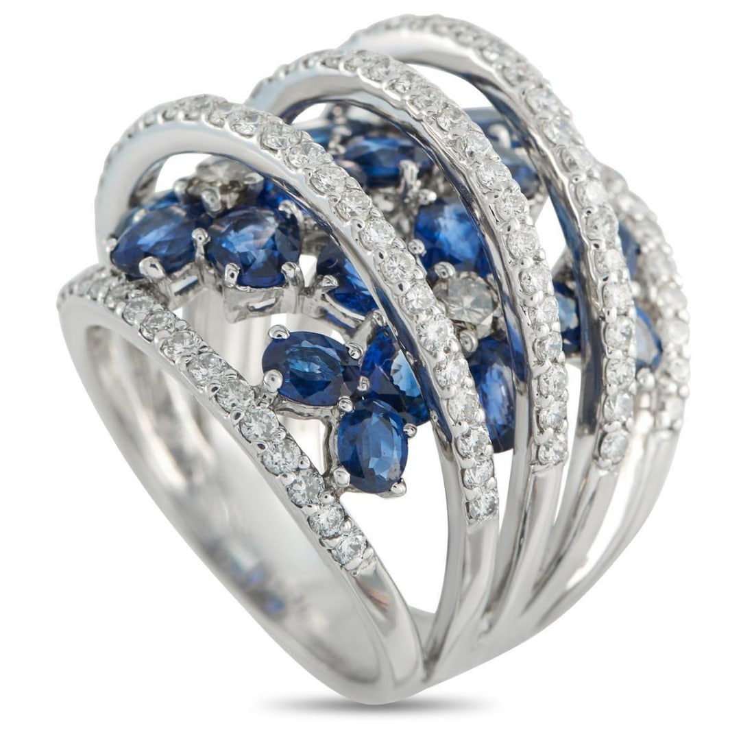 18K WHITE GOLD 2.28CT DIAMOND AND SAPPHIRE RING: An ring, perfect for when you want a bit of color that stays current. This wide band sits across the finger with a mosaic of sapphires, each held by prongs for a scattered effect. White gold arcs set
