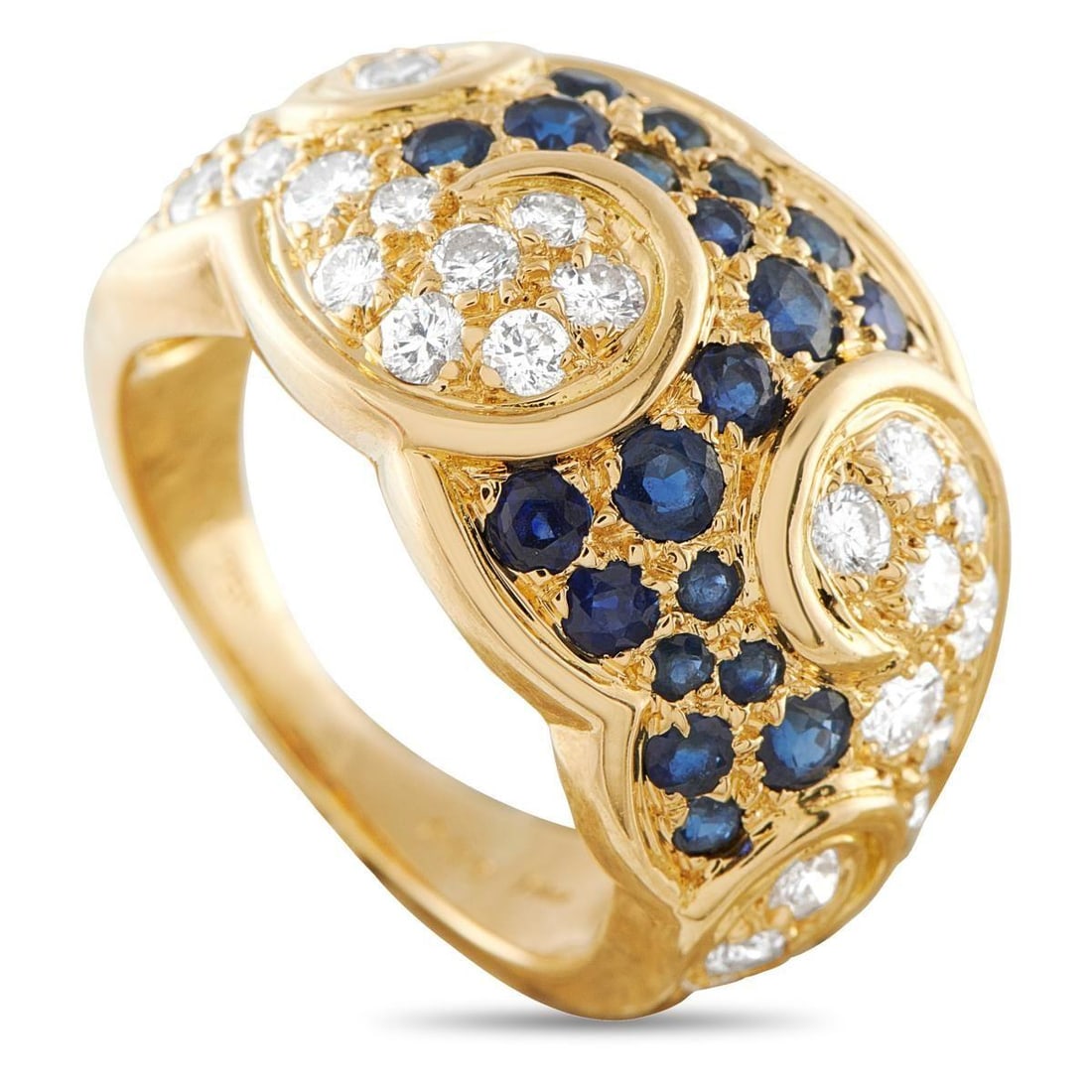 DIOR 18K YELLOW GOLD 0.75CT DIAMOND AND SAPPHIRE RING: This Dior ring is bold, exciting, and ideal for any occasion. A stunning combination of Sapphires and Diamonds totaling 0.75 carats come together in a swirling pattern at the top of the design. Set in