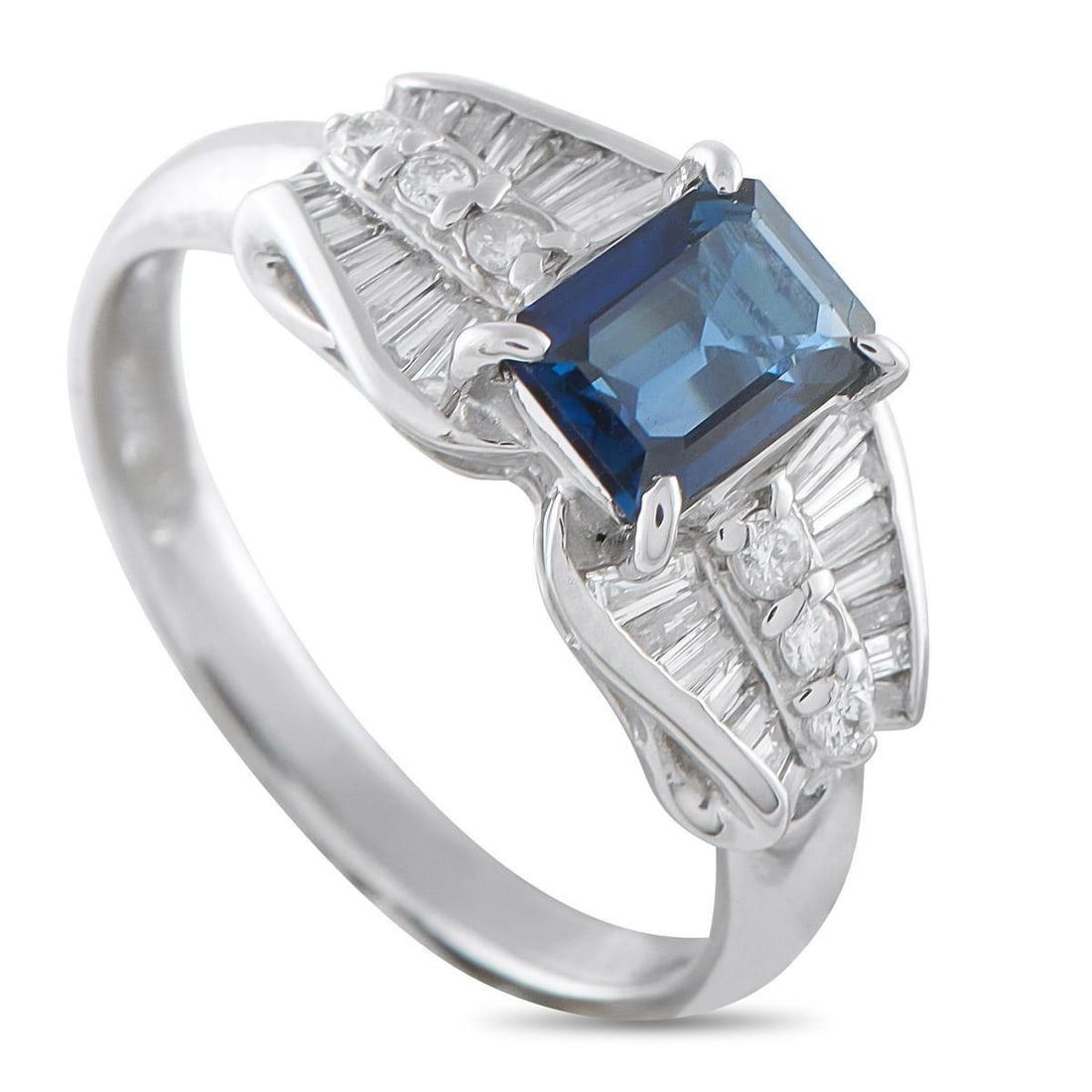 PLATINUM 0.43CT DIAMOND AND SAPPHIRE RING: This ring displays a stunning blend of vintage geometry and feminine grace. It has a 1.24-carat rectangular sapphire as its center stone, secured by prongs at each corner. The side stones introduce th