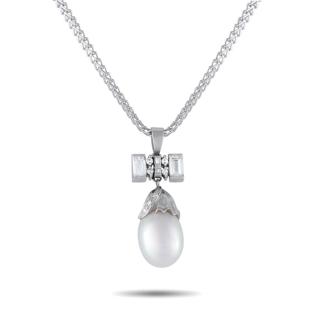 PLATINUM 0.85CT DIAMOND AND PEARL PENDANT NECKLACE: This luxury necklace is incredibly chic. A luminous Pearl center stone serves as a stunning focal point, while Diamond accents with a total weight of 0.85 carats elevate the overall design. Set in Pla