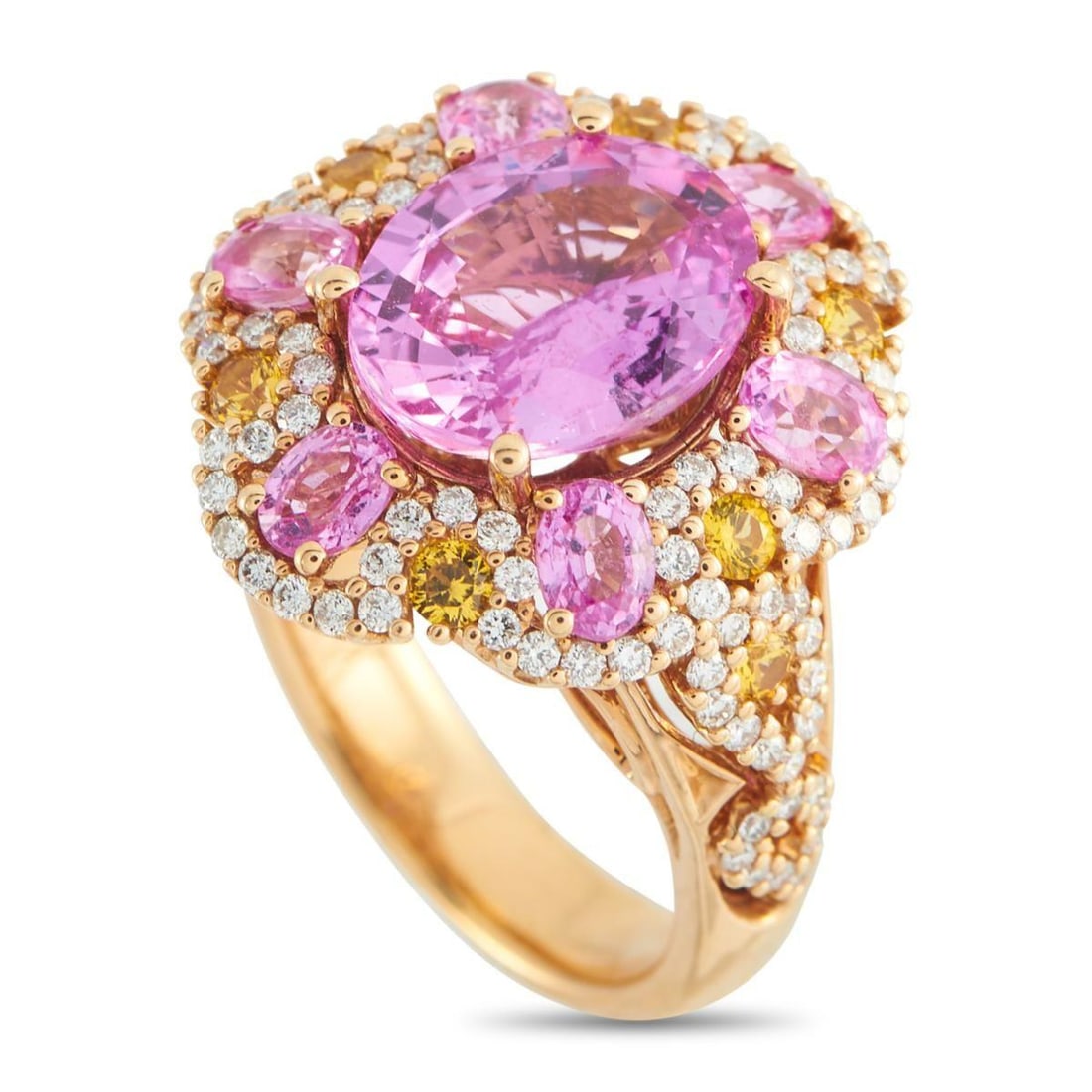 18K ROSE GOLD 0.85CT DIAMOND AND SAPPHIRE RING: This luxury ring exudes timeless romance. The intricate 18K Rose Gold setting beautifully showcases a stunning array of sparkling gemstones. A 4.50 carat Pink Sapphire is surrounded by additional Pink