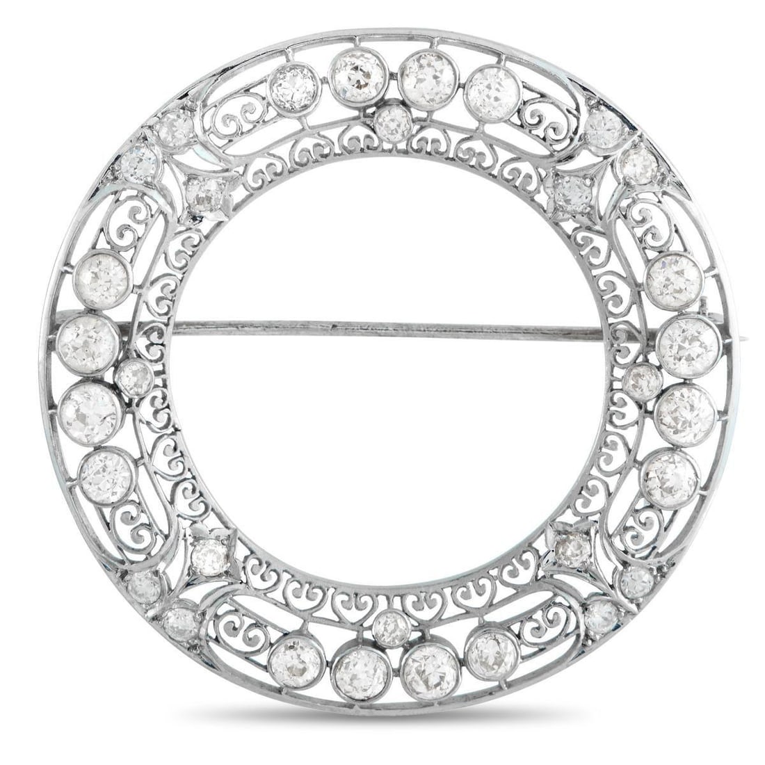 PLATINUM 3.75CT DIAMOND WREATH BROOCH: A continuous ring of light. This Edwardian-style brooch is designed like a wreath, with lace-like filigree, pierced and patterned with repeating motifs. Round diamonds are embedded in smooth, circular