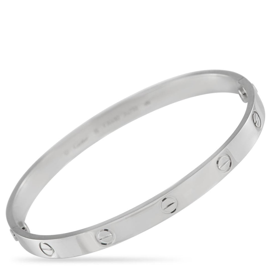 CARTIER LOVE 18K WHITE GOLD BRACELET SIZE 19: This Cartier LOVE bracelet is chic, sophisticated, and instantly recognizable. Ideal for adding a touch of luxury to any ensemble, the sleek 18K White Gold bangle includes the collections iconic circu