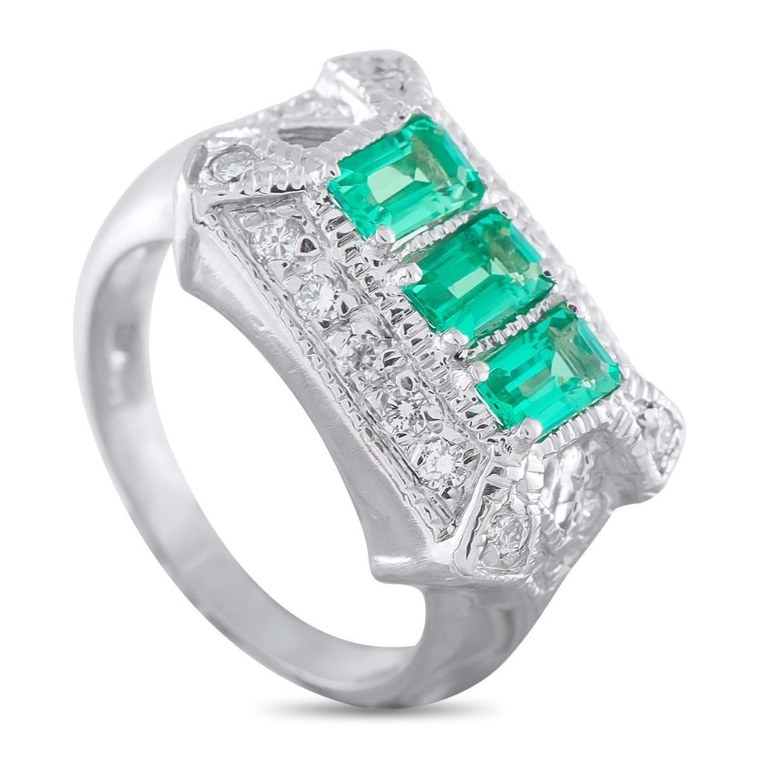 PLATINUM 0.18CT DIAMOND AND EMERALD RING: A trio of Emerald gemstones totaling 1.20 carats add a stylish pop of color to the center of this exquisite ring. Set in Platinum, this piece comes to life thanks to a stunning array of Diamonds total