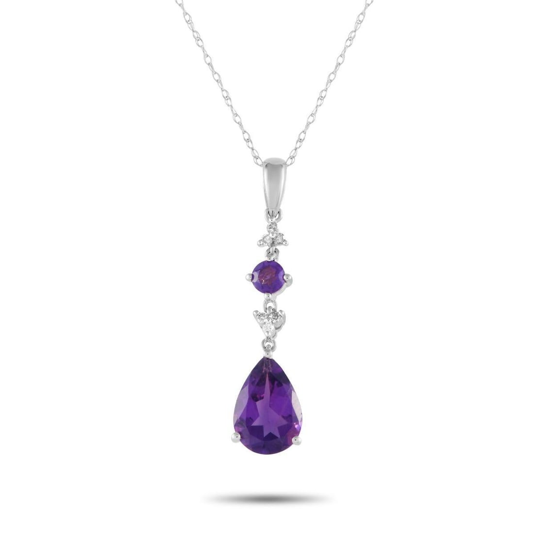 14K WHITE GOLD 0.05CT DIAMOND AND AMETHYST PENDANT NECKLACE: A pair of amethyst gemstones add color and visual impact to this timeless necklace. Sleek and elegant in design, it features a 14K white gold pendant measuring 1.25 long by 0.25 wide suspended from an