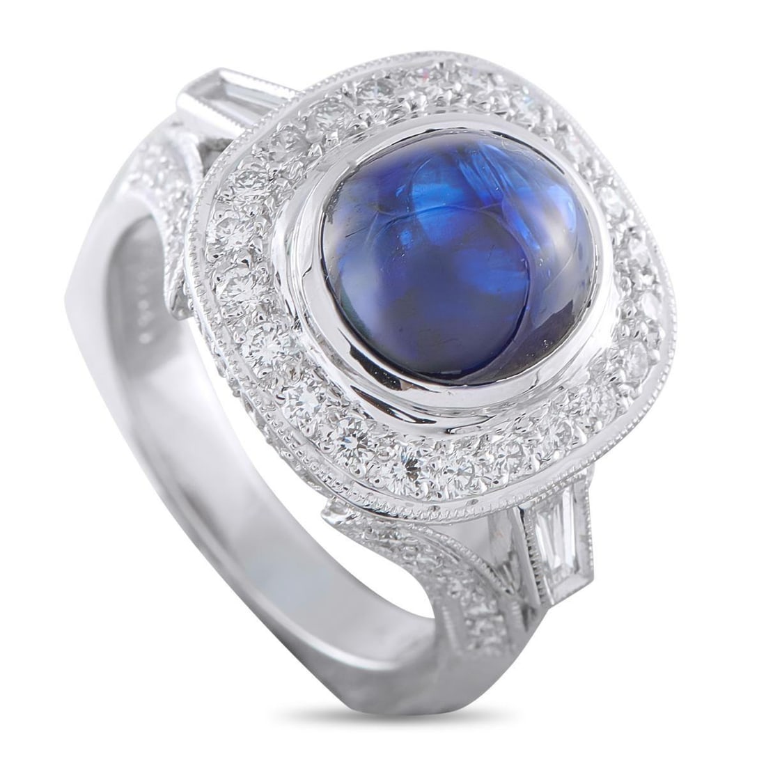 18K WHITE GOLD 0.85CT DIAMOND AND SAPPHIRE RING: A detailed 18K White Gold setting accented by Diamonds totaling 0.85 carats allows this luxury ring to effortlessly emanate light. At the center, a 4.82 carat Sapphire cabochon makes it a unique piece