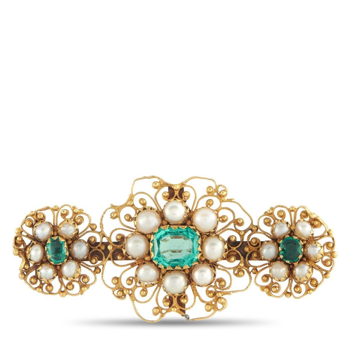 18K YELLOW GOLD 1.10CT EMERALD BROOCH: Intricate metalwork makes this brooch simply exquisite. The breathtaking design is elevated by pearlescent accents, while Emeralds totaling 1.10 carats ensure it always catches the light. Crafted from