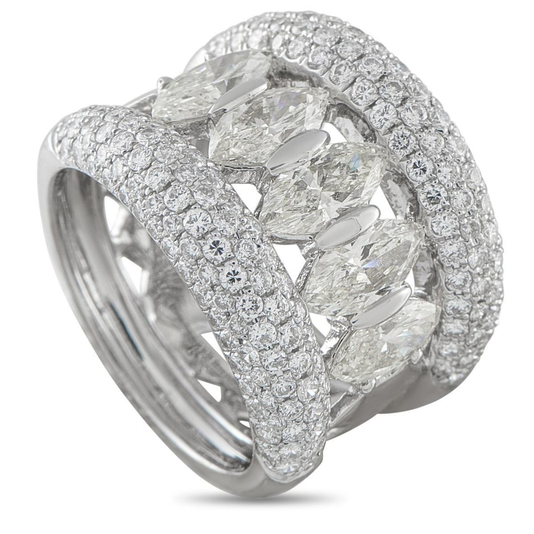 18K WHITE GOLD 3.60CT DIAMOND WIDE BAND RING: Light catches this ring like it was built to defy the ordinary. An 18K white gold band stretches wide, its domed edges draped in pav diamonds. At its open center, baguette diamonds are set in a vertic