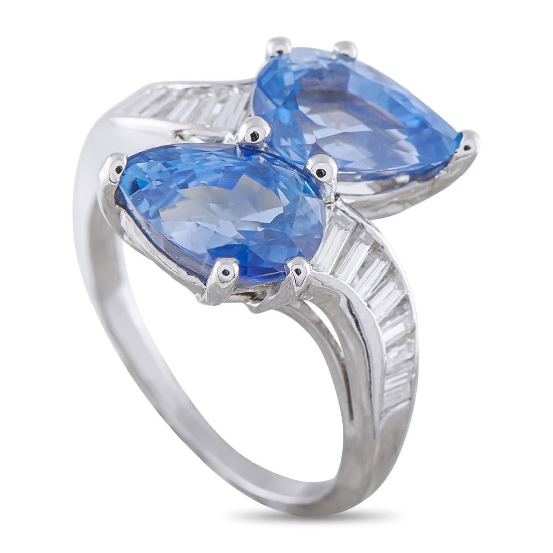 PLATINUM 0.60CT DIAMOND AND SAPPHIRE RING: Pear-shaped Sapphires with a total weight of 6.0 carats allow this ring to come alive with color. Striking and statement-making, the sleek Platinum setting is elevated by inset Diamonds totaling 0.60