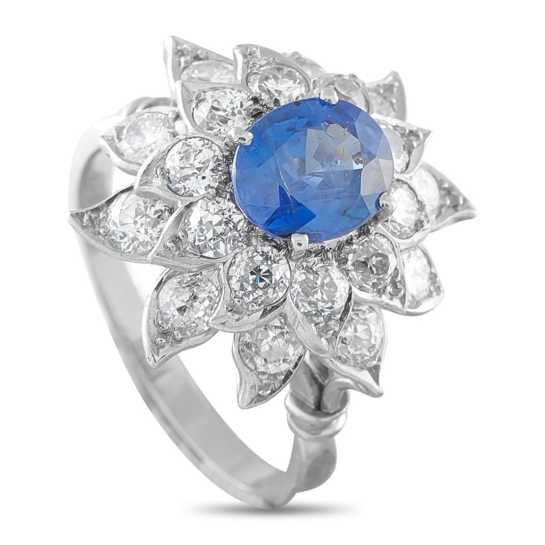 PLATINUM 2.25CT DIAMOND AND CEYLON SAPPHIRE FLOWER RING: Inspired by nature, executed in precious stones and high-value precious metal. This flower-motif ring features a 2.87-carat Ceylon sapphire with no indications of thermal treatment. The blue oval gems