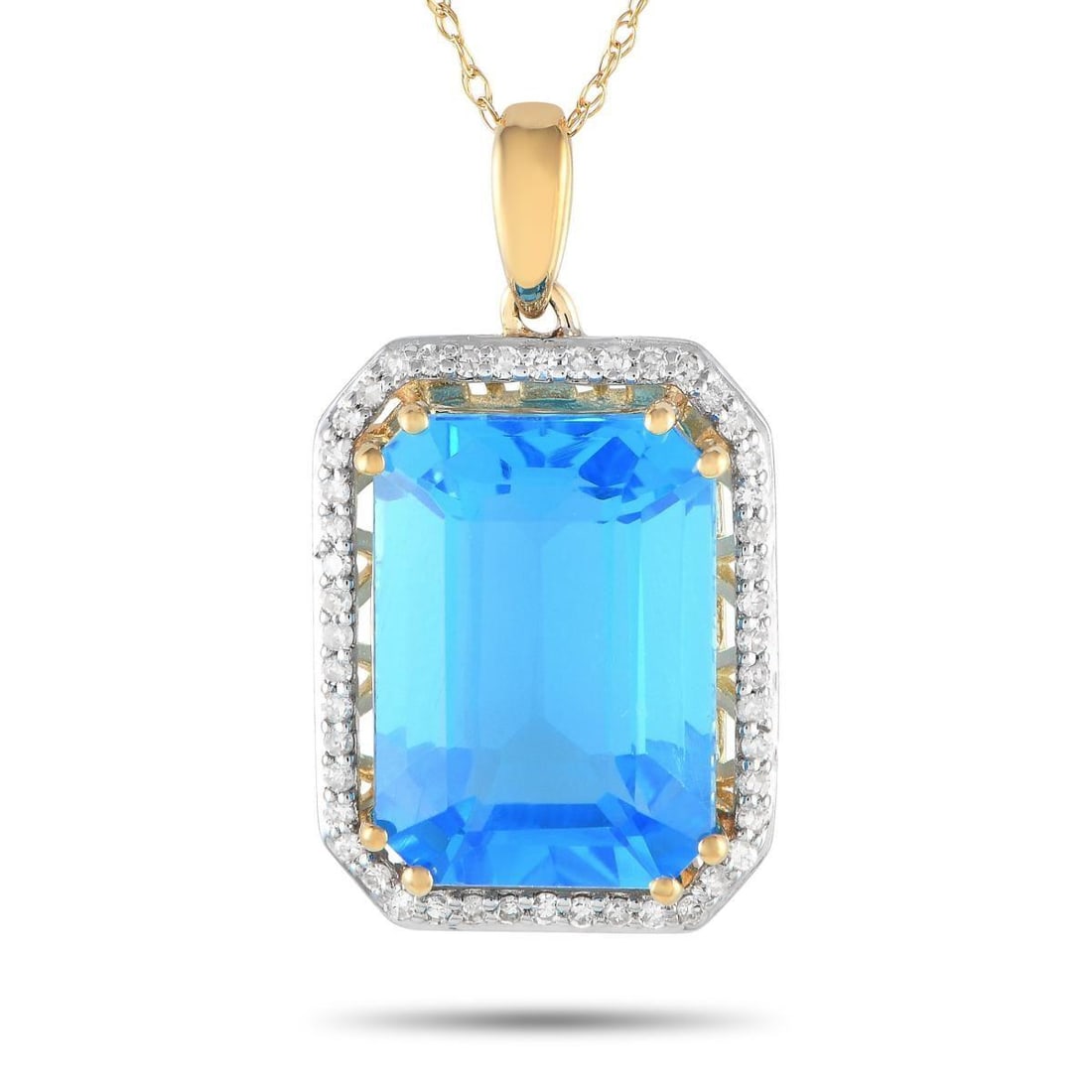 14K YELLOW GOLD 0.20CT DIAMOND AND BLUE TOPAZ NECKLACE: Mark a special occasion with the exquisite beauty of this diamond and blue topaz necklace. The octagonal pendant measures 1 by 0.50 and has a frame of petite round diamonds. Sitting prominently at the