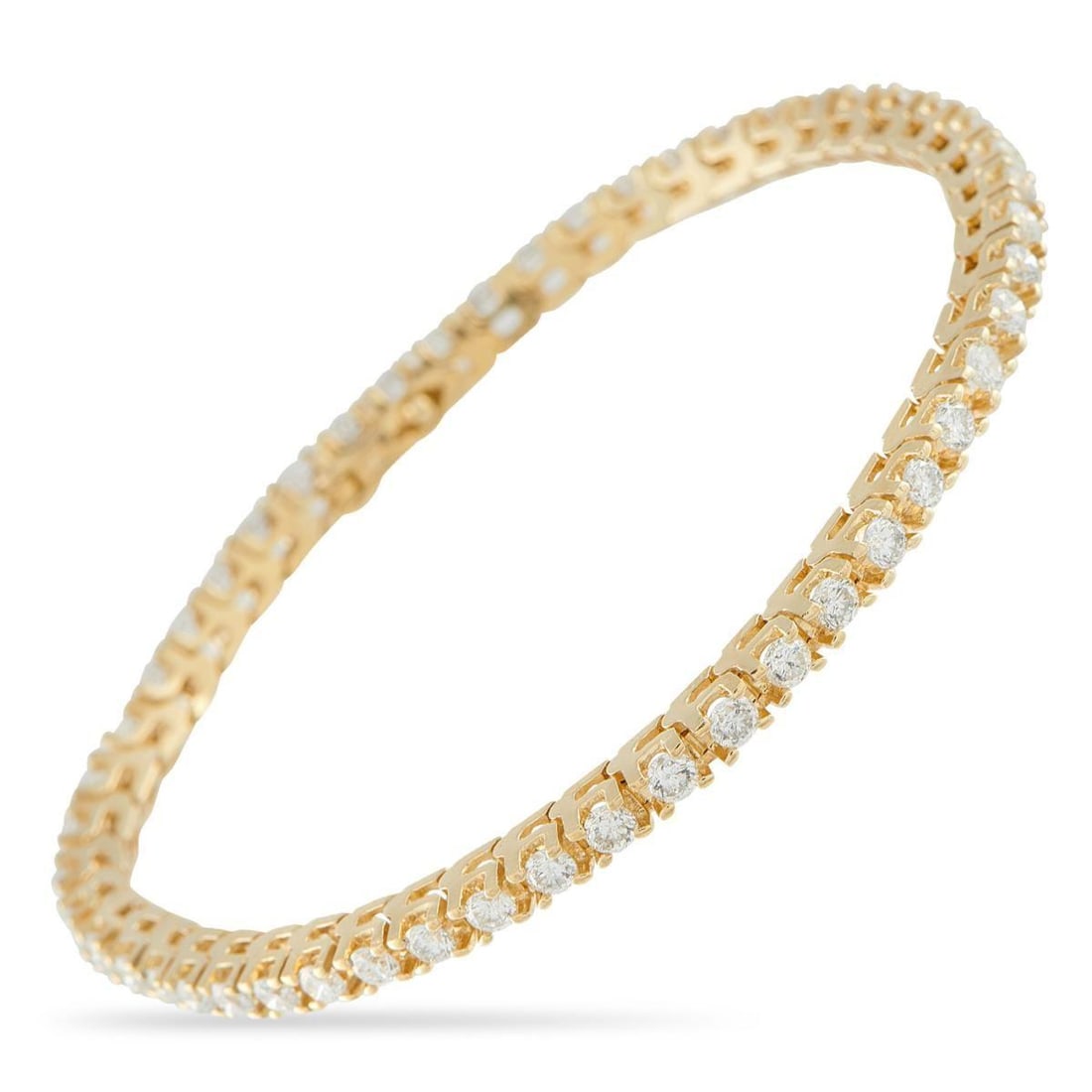 14K YELLOW GOLD 2.50CT DIAMOND TENNIS BRACELET: This tennis bracelet is an instant classic. Set in 14K Yellow Gold, a series of sparkling Diamonds totaling 2.50 carats make it an exquisite luxury piece that is ideal for everyday wear. It measures 7