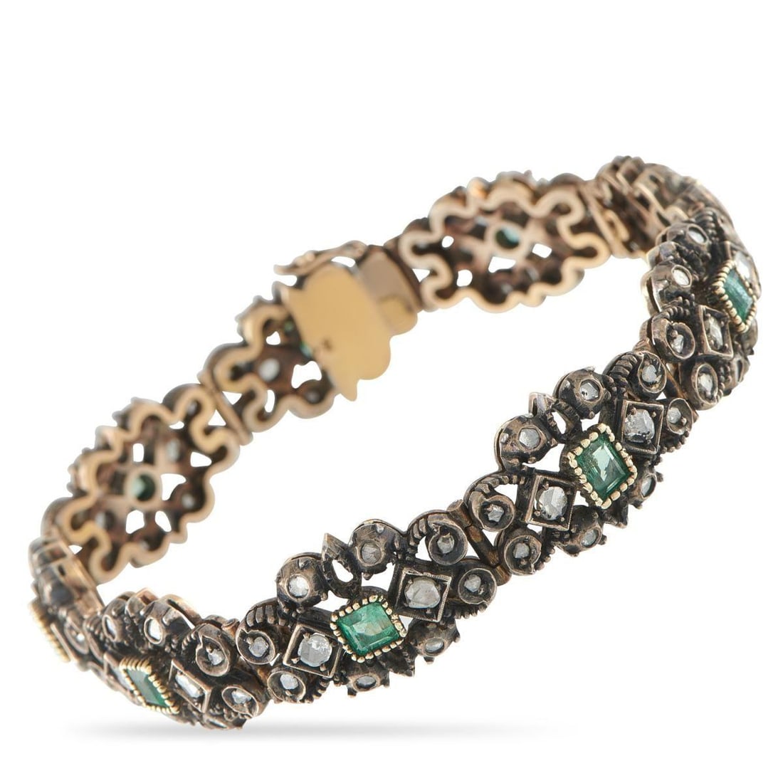 18K ROSE GOLD AND SILVER DIAMOND AND EMERALD BRACELET: This luxury bracelet is filled with exquisite details. Crafted from a combination of 18K Rose Gold and Silver, Emerald accents provide this piece with a stylish pop of color. Rose-cut Diamonds make it