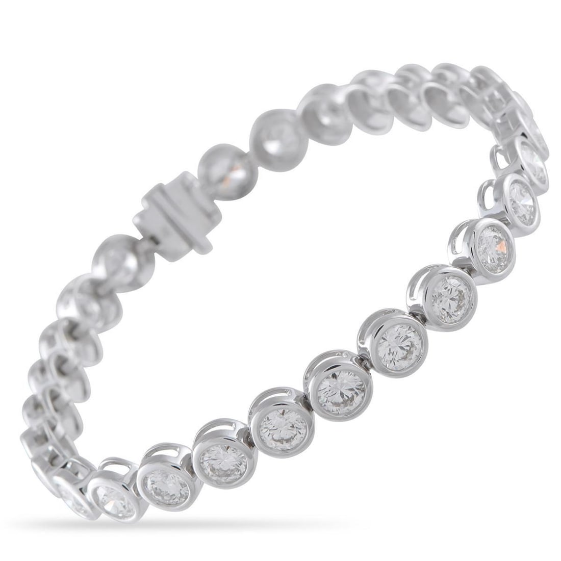 18K WHITE GOLD 9.0CT DIAMOND BRACELET: A series of bezel-set Diamonds totaling 9.0 carats make this luxury bracelet incredibly elegant. Crafted from 18K White Gold, a chic, contemporary in design makes it a stunning addition to any ensembl