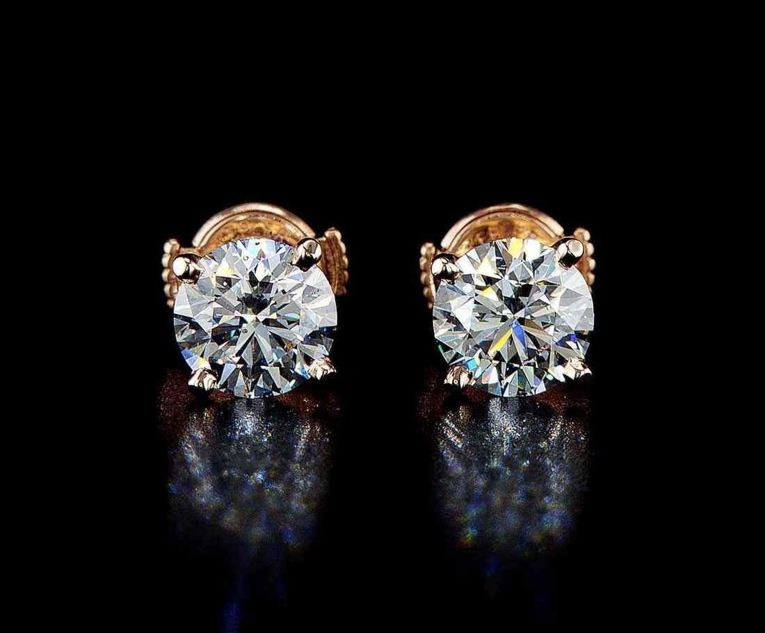 14kt Rose Gold 2.4ctw Diamond Earrings: One pair of 14k rose gold earrings, each set with one lab grown diamond. Jewelry Weight: 1.82Grs Total Diamonds Weight: 2.4Cts Main Stones Description: Quantity: 2 Cut and shape: Round Brilliant Carat