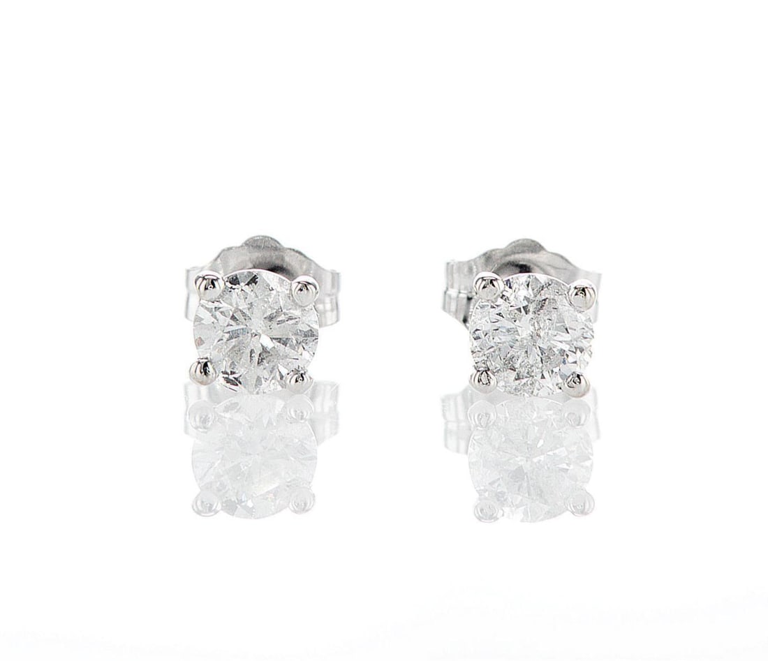 14kt White Gold 0.95ctw Diamond Earrings: Jewelry Description Description: One pair of 14k white gold earrings, set with natural diamonds. Jewelry Weight: 0.82 Grs Total Diamonds Weight: 0.95 Cts Precious Metal: 14kt White Gold Certificate Nu