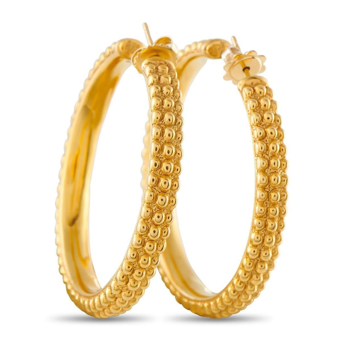 ROBERTO COIN 18K YELLOW GOLD HOOP EARRINGS: These stunning Roberto Coin hoop earrings are delightfully unexpected. Crafted from 18K Yellow Gold, textured metalwork adds dimension to the simple silhouette. Each earring measures 1.75 round making