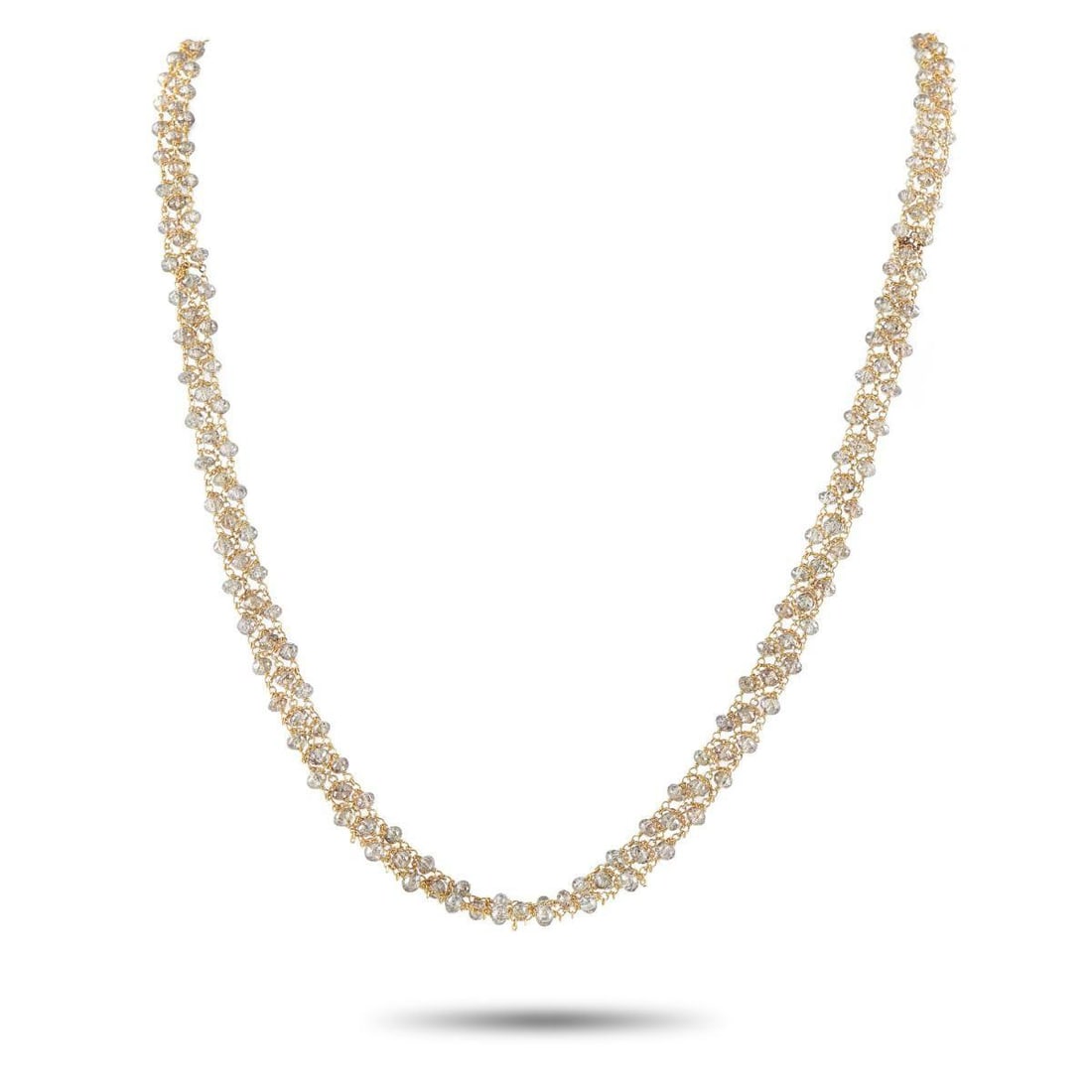 18K YELLOW GOLD 24.5CT DIAMOND BRIOLETTE NECKLACE: This piece features an exquisite display of fluid elegance with its meticulously woven design that mimics the effervescence of shimmering bubbles. Rather than traditional prong settings, this necklace