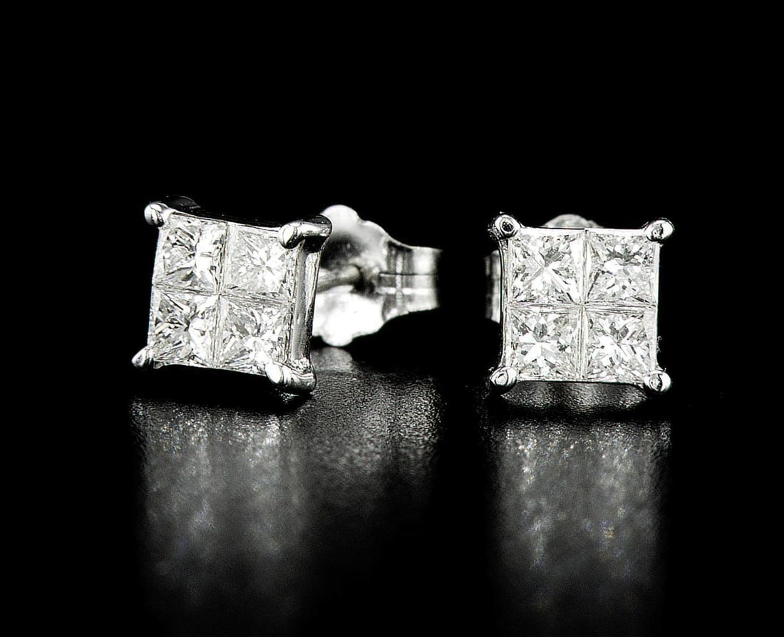 18kt White Gold 0.8ctw Diamond Earrings: One pair of 18k white gold earrings (18k stamped), each set with natural diamonds. Jewelry Weight: 1.2Grs Total Diamonds Weight: 0.8Cts Main Stones Description: Quantity: 8 Cut and shape: Princess Car