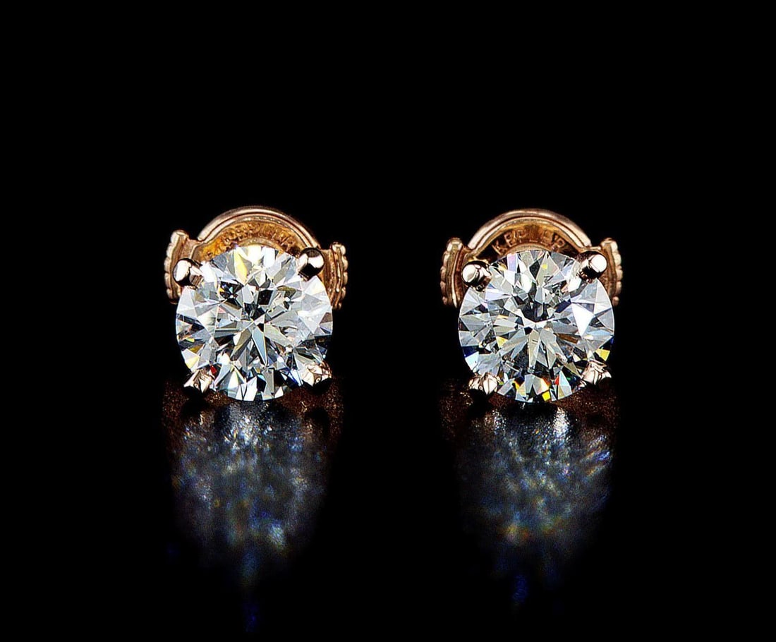 14kt Rose Gold 2.18ctw Diamond Earrings: One pair of 14k rose gold earrings, each set with one lab grown diamond. Jewelry Weight: 1.82Grs Total Diamonds Weight: 2.18Cts Main Stones Description: Quantity: 2 Cut and shape: Round Brilliant Cara