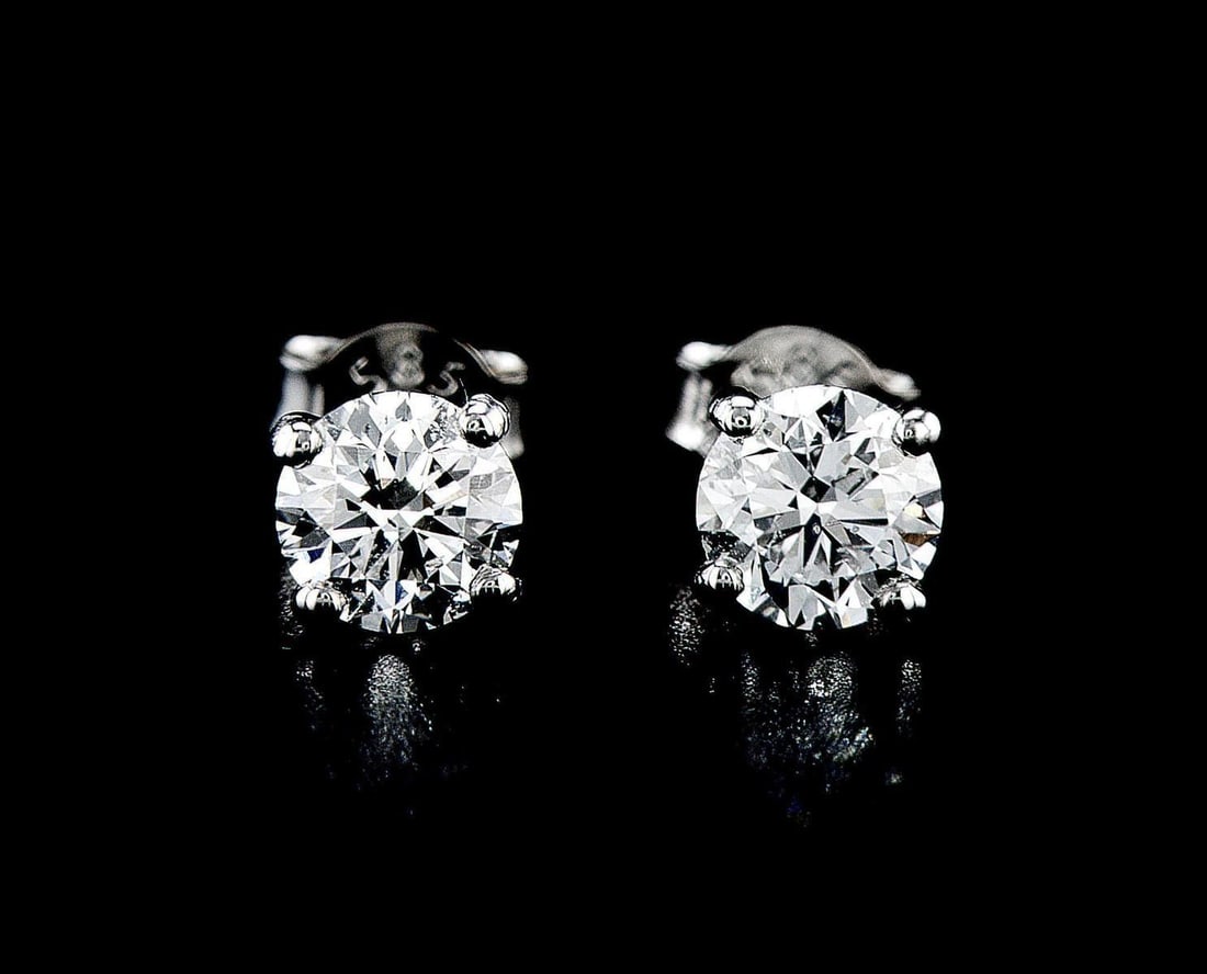 14kt White Gold 1.4ctw Diamond Earrings: One pair of 14k white gold earrings (14k stamped), each set with lab grown. Jewelry Weight: 1.32Grs Total Diamonds Weight: 1.4Cts Main Stones Description: Quantity: 2 Cut and shape: Round Brilliant Ca