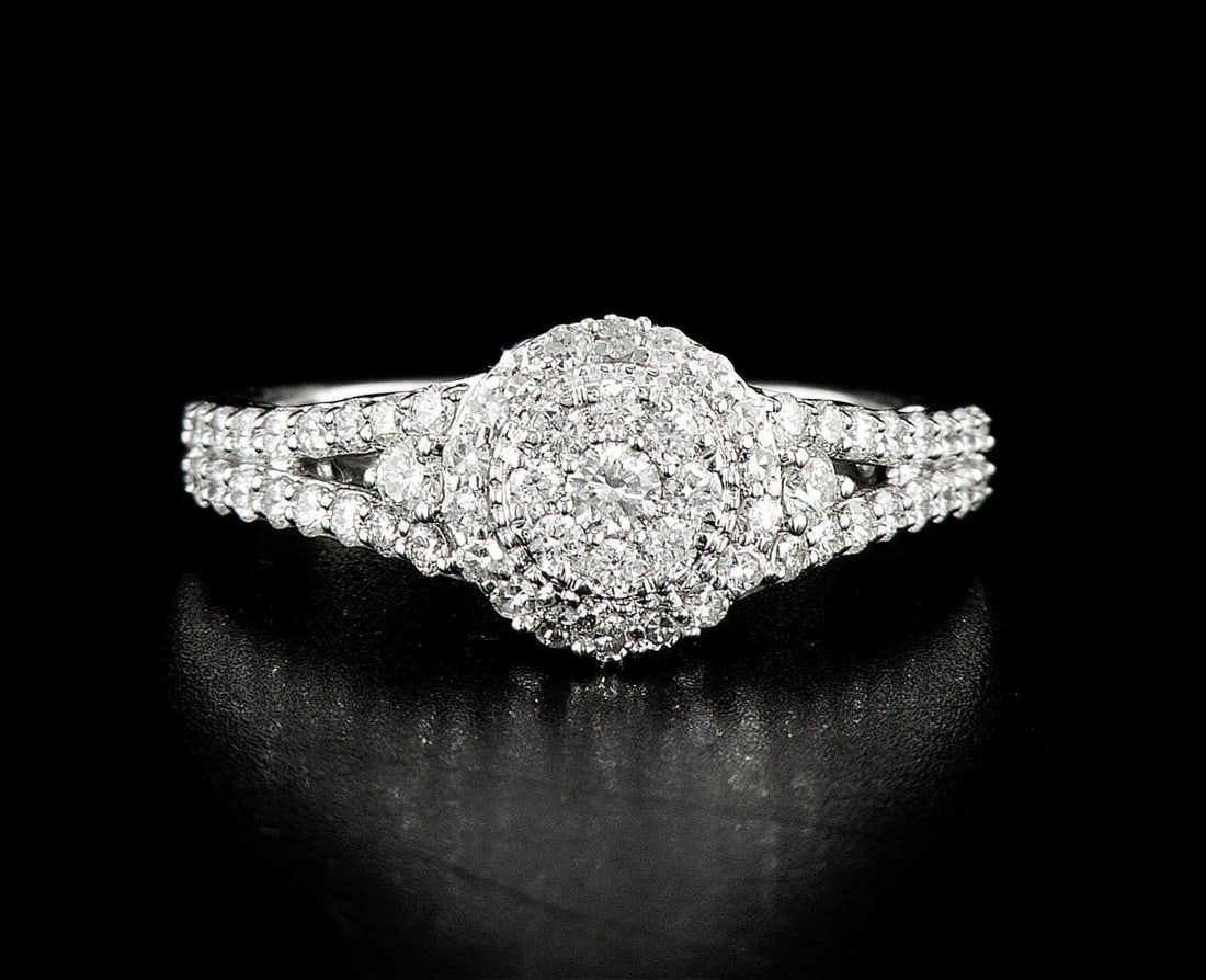 14kt White Gold 0.91ctw Diamond Ring: One 14k white gold ring (14k stamped), set with natural diamonds. Jewelry Weight: 3.74Grs Total Diamonds Weight: 0.91Cts Main Stones Description: Cut and shape: Round Carats Weight: 0.91 Clarity: VS C