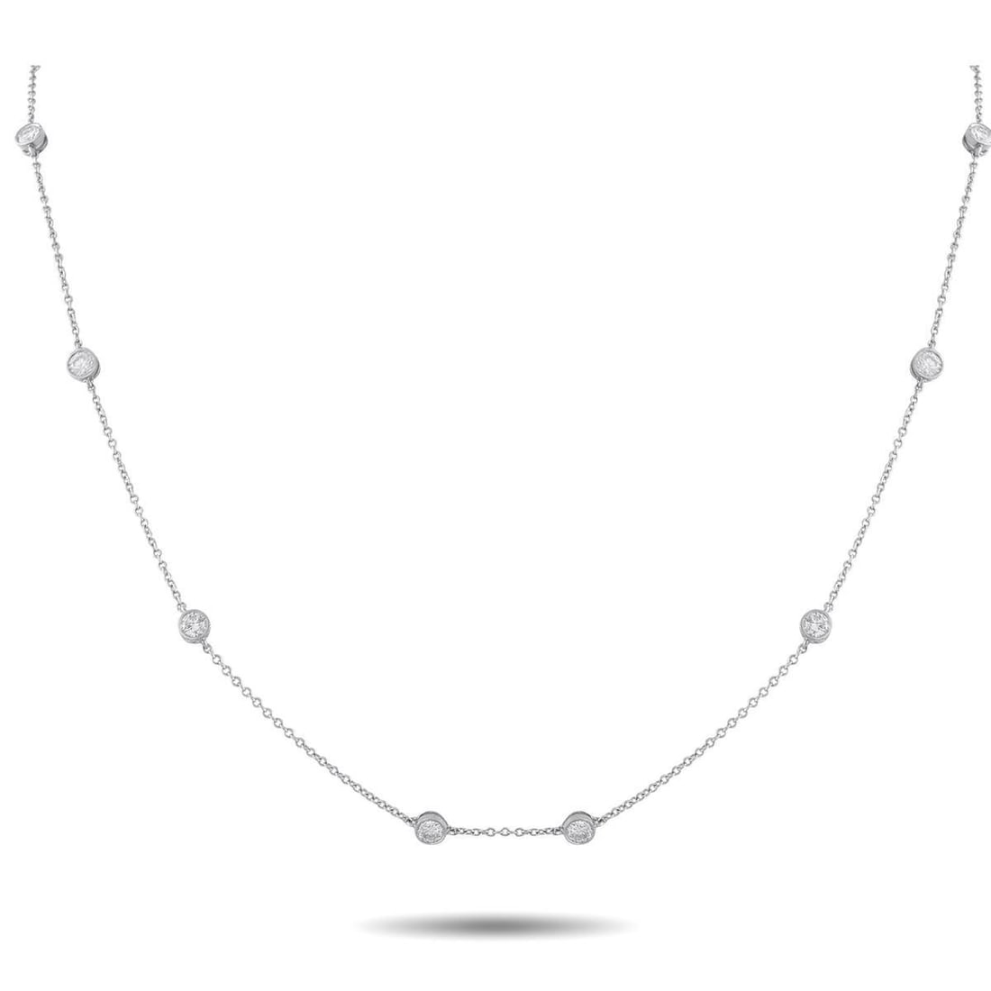 TIFFANY & CO. ELSA PERETTI DIAMONDS BY THE YARD PLATINUM 1.20CT DIAMOND NECKLACE: This Tiffany & Co. Elsa Peretti Diamonds by the Yard necklace is stunning in its simplicity. The delicate chain is adorned with bezel-set Diamonds totaling 1.20 carats, making it an understated luxury
