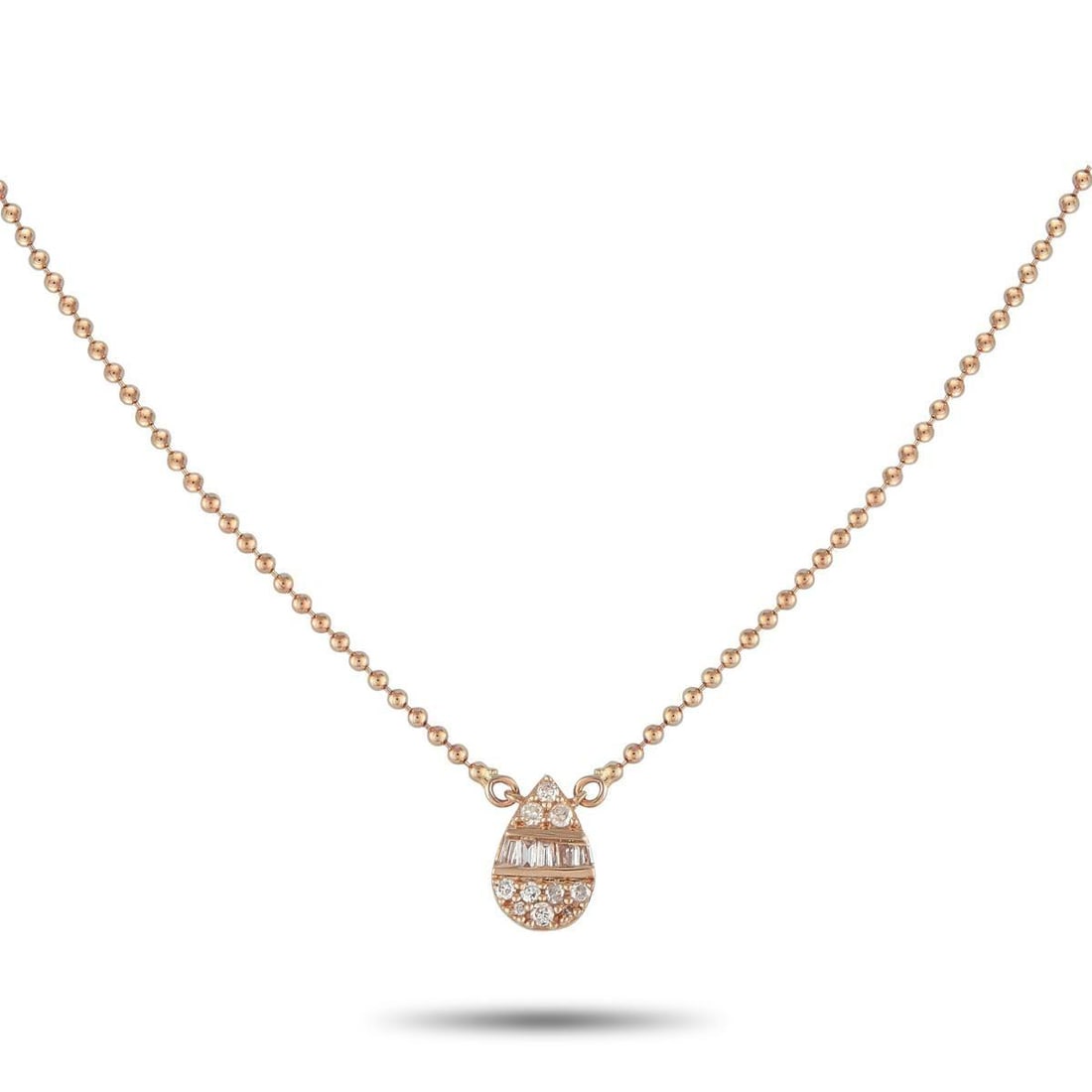 14K ROSE GOLD 0.11CT DIAMOND NECKLACE: You'll find yourself reaching for this necklace daily. Crafted for comfort and versatility, it features a fine and lightweight ball chain holding a pear-shaped cluster pendant of round and baguette di