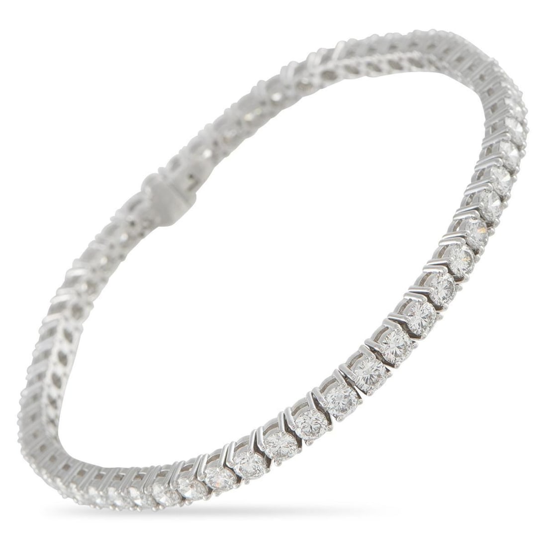 18K WHITE GOLD 6.91CT DIAMOND TENNIS BRACELET: A classically elegant design makes this tennis bracelet an essential addition to any jewelry collection. Set in 18K White Gold, Diamonds with a total weight of 6.91 carats provide endless sparkle. It 
