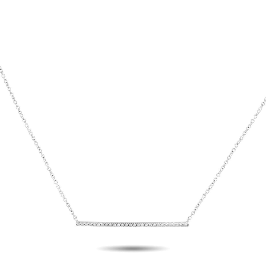 14K WHITE GOLD 0.10CT DIAMOND NECKLACE: This sleek, sophisticated necklace is the perfect way to add a touch of luxury to any outfit or occasion. The understated design features a series of Diamonds totaling 0.10 carats accenting a slender 