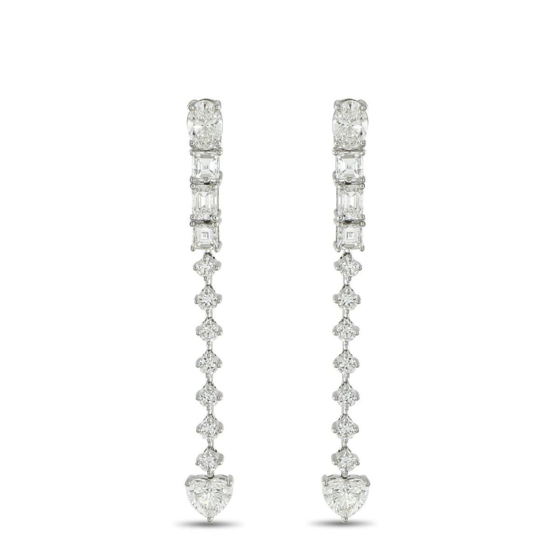 18K WHITE GOLD 3.95CT DIAMOND DANGLE EARRINGS: Geometry meets romance in these 18K white gold dangle earrings. Like a story told in facets, these earrings begin with an oval diamond at the post. Step-cut diamonds mark the rhythm, followed by a ver