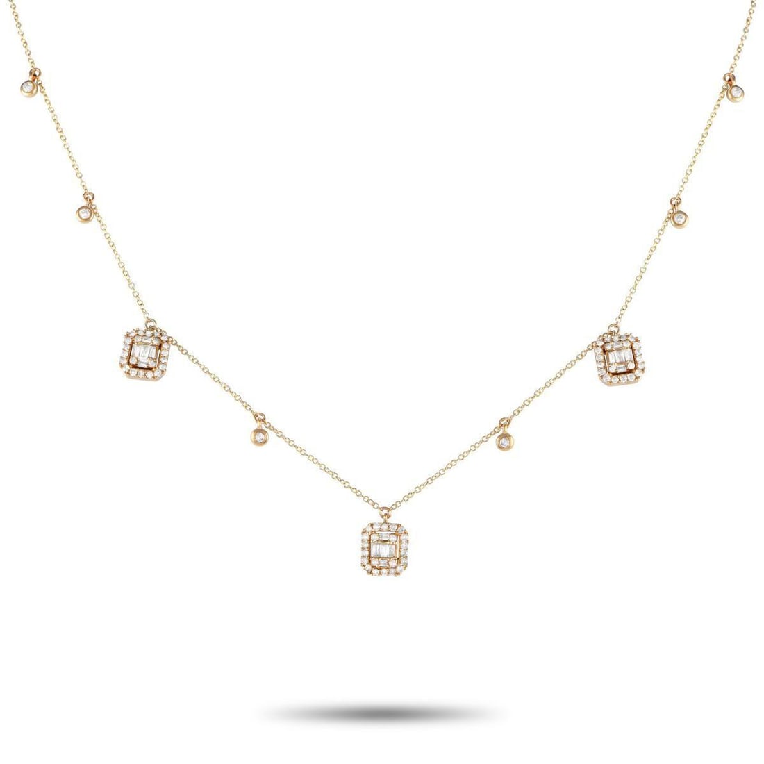 14K YELLOW GOLD 0.70CT DIAMOND NECKLACE: A beautifully made necklace infused with bohemian elegance and a hint of vintage charm. The chain is cast in 14K yellow gold and features six bezel-set round diamonds set on stations along its length.