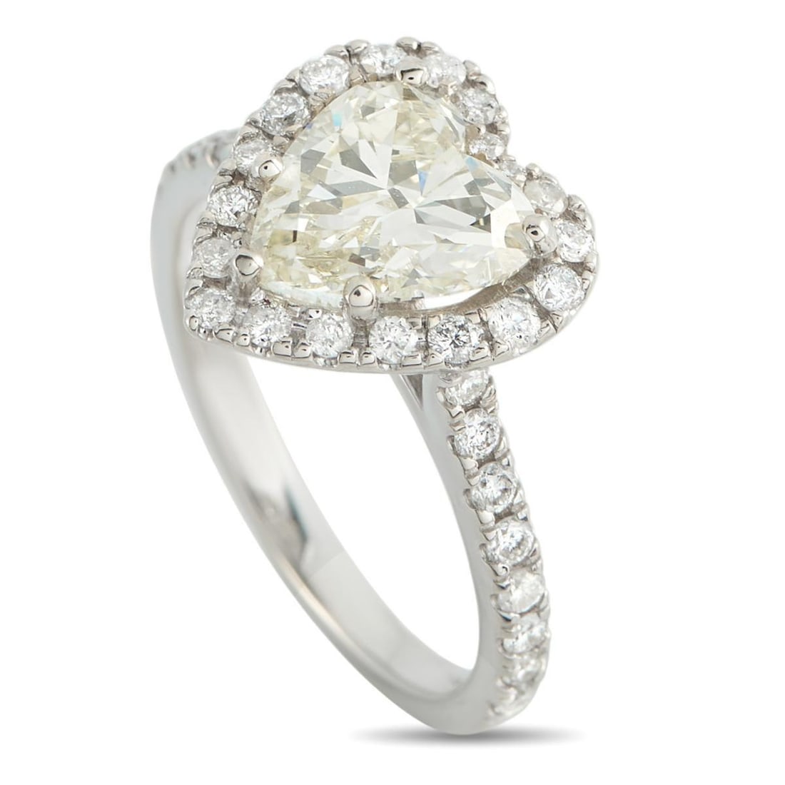 14K WHITE GOLD 2.31CT DIAMOND HEART RING: A heart-cut diamond remains one of the most distinct symbols used in engagement jewelry. Here, a 1.98-carat heart-shaped diamond graded M -VS2 sits in a five-prong setting. A halo of round diamonds tr