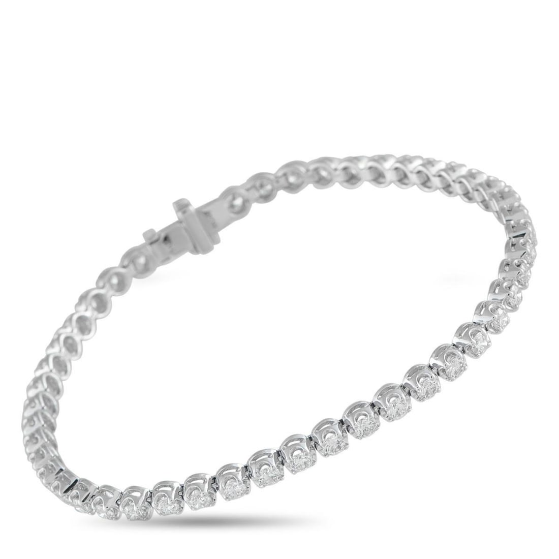 14K WHITE GOLD 3.20CT DIAMOND BRACELET: Crafted in 14K white gold, this bracelet features a fluid line of 3.20 carats of diamonds for a look that's polished and effortlessly wearable. The design keeps the sparkle controlled and elegant, mak