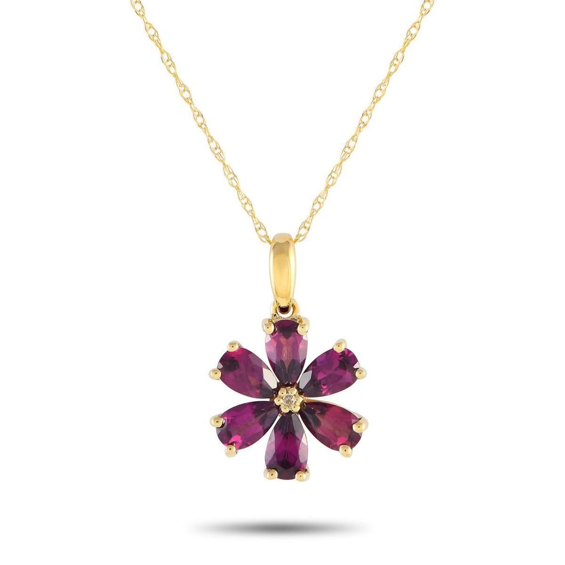 14K YELLOW GOLD 0.01CT DIAMOND AND RHODOLITE FLOWER NECKLACE: Rhodolite gemstones in a floral pattern make this 14K yellow gold necklace an effortless addition to any ensemble. Sleek, elegant, and incredibly sophisticated, this pieces pendant measures 0.75 long 